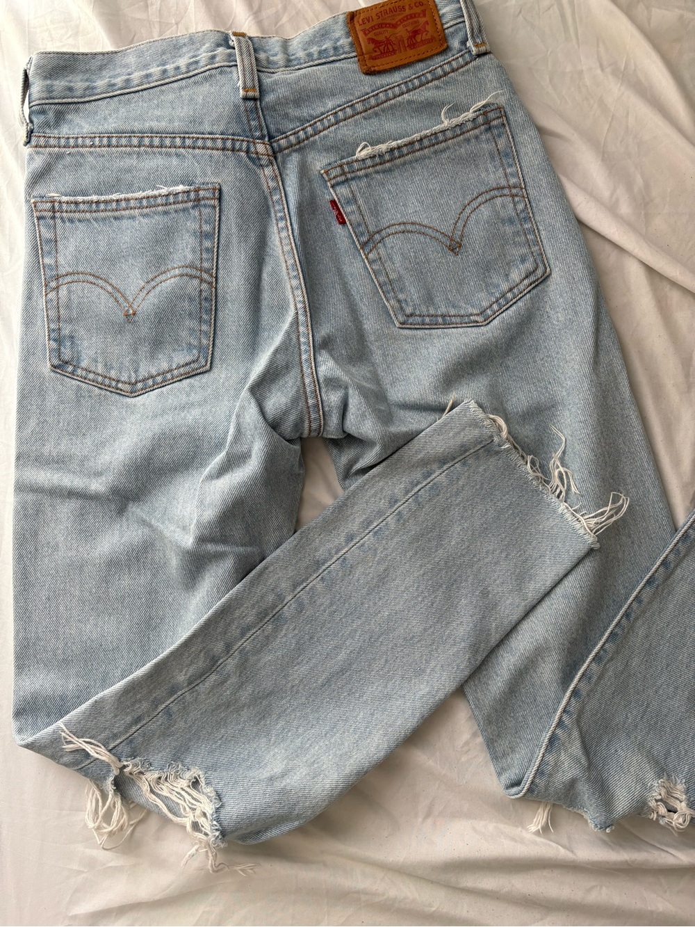 Levi's Light Wash Straight Leg Jeans with Frayed Hems